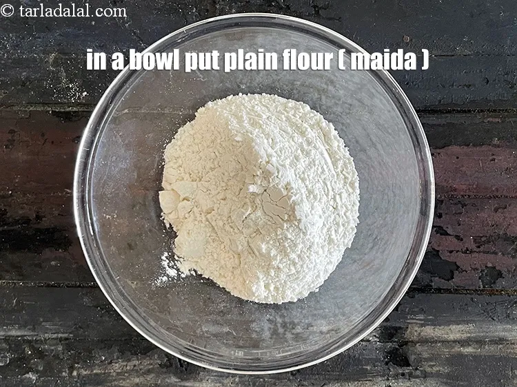 Step 32 – In a bowl put&nbsp;<meta charset="UTF-8" />1/2 cup&nbsp;<a href="glossary-plain-flour-maida-188i">plain flour (maida)</a>.