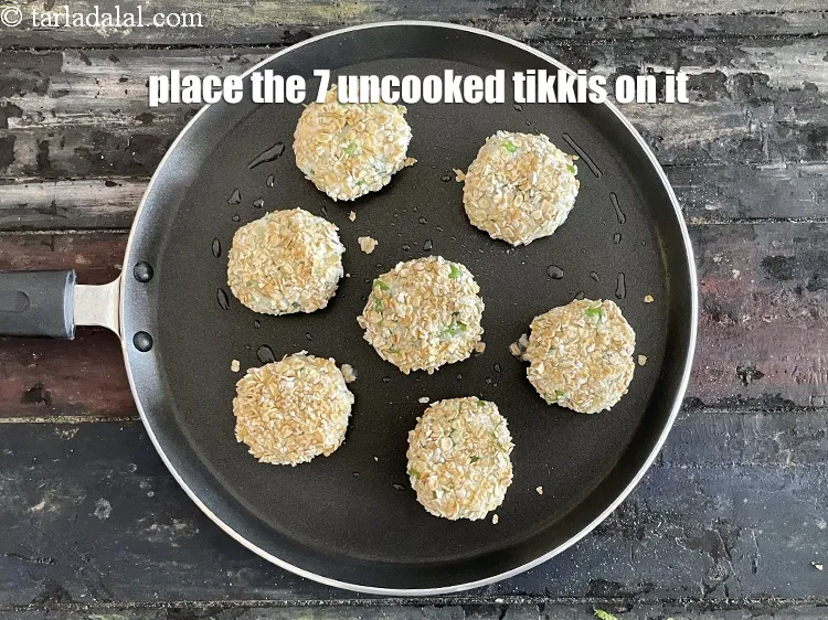 Step 19 – <meta charset="UTF-8" /> Place the 7&nbsp;tikkis carefully on the tava. We will be cooking tikkis …