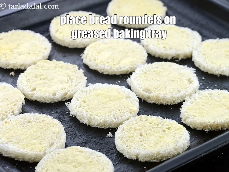 Step 17 – Place the bread roundels on a greased baking tray.