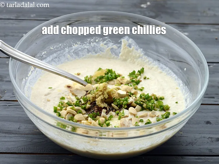 Step 26 – Add 2 tsp&nbsp;finely&nbsp;<a href="https://www.tarladalal.com/glossary-chopped-green-chilli-820i">chopped green chillies</a>. We have used dark green variety of green chillies …
