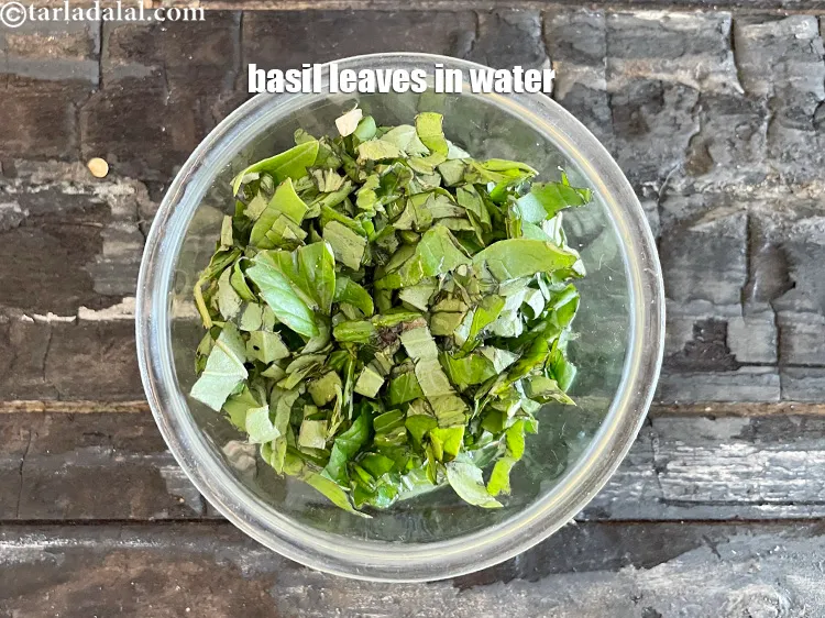 Step 29 – Meanwhile, in a bowl put&nbsp;<meta charset="UTF-8" />1/4 cup&nbsp;fresh&nbsp;<a href="glossary-basil-185i">basil leaves</a>&nbsp;<meta charset="UTF-8" />with &frac14; cup of …