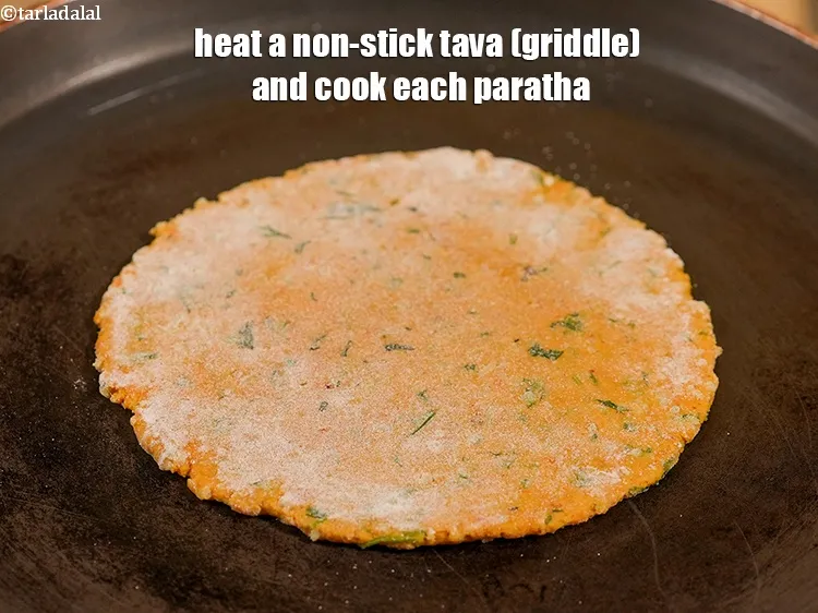 Step 22 – Heat a non-stick tava (griddle) and cook each paratha.