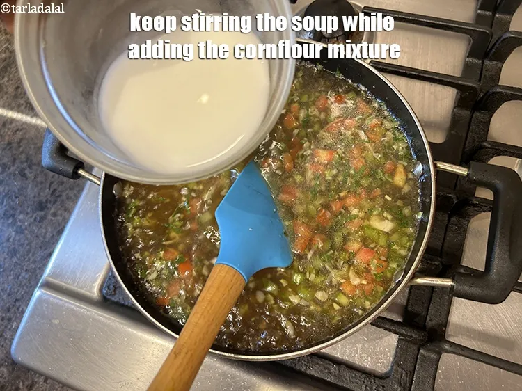 Step 23 – Keep stirring the soup while adding the cornflour mixture.&nbsp;Stirring helps to distribute the cornflour mixture …