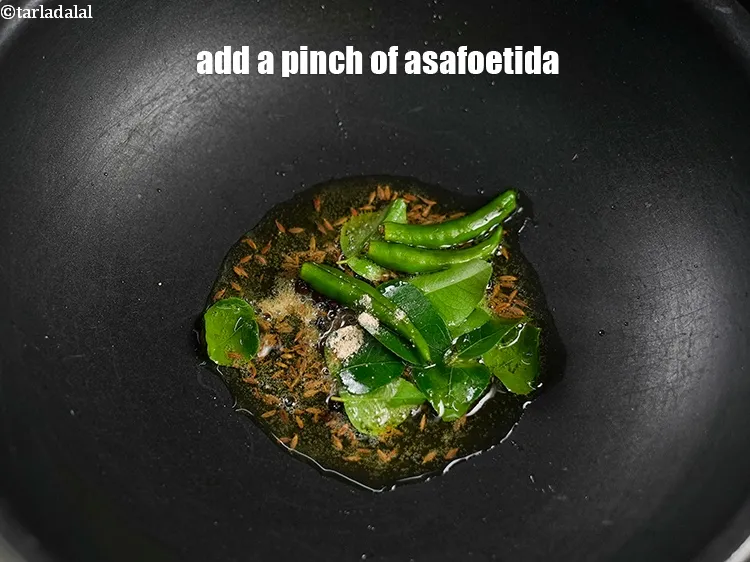 Step 18 – Add a pinch of asafoetida.&nbsp;