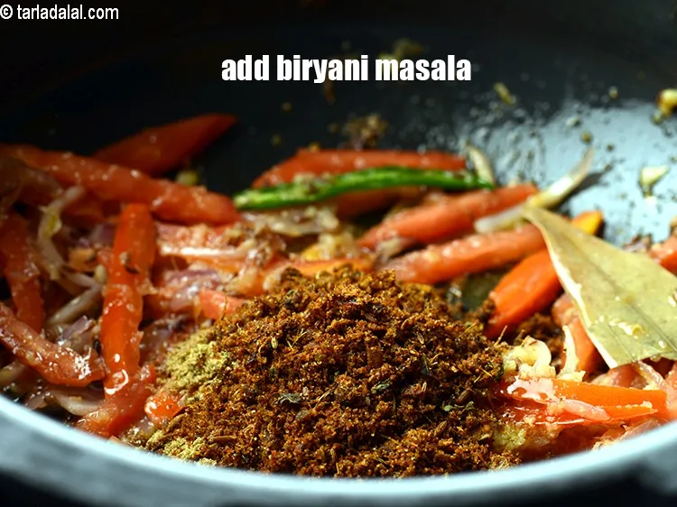 Step 18 – Add 1 tbsp <a href="https://www.tarladalal.com/biryani-masala-42034r">biryani masala</a>.