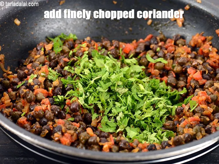 Step 18 – Add 2 tsp finely <a href="https://www.tarladalal.com/glossary-chopped-coriander-783i">chopped coriander (dhania)</a>.