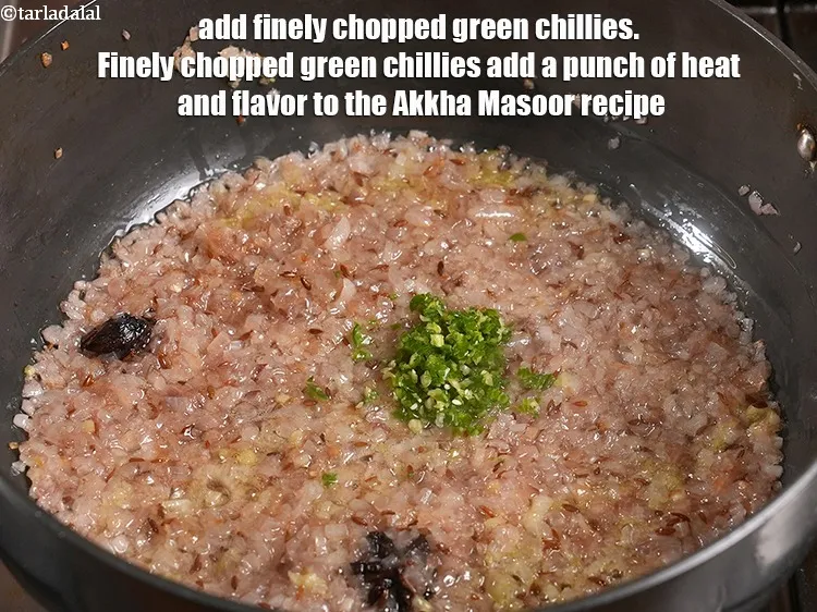 Step 18 – Add &frac12; tsp finely chopped green chillies.&nbsp;Finely chopped green chillies add a punch of heat …