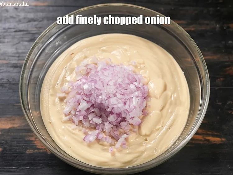 Step 18 – Add &frac34; cup finely <a href="https://www.tarladalal.com/glossary-chopped-onions-722i">chopped onions</a>.
