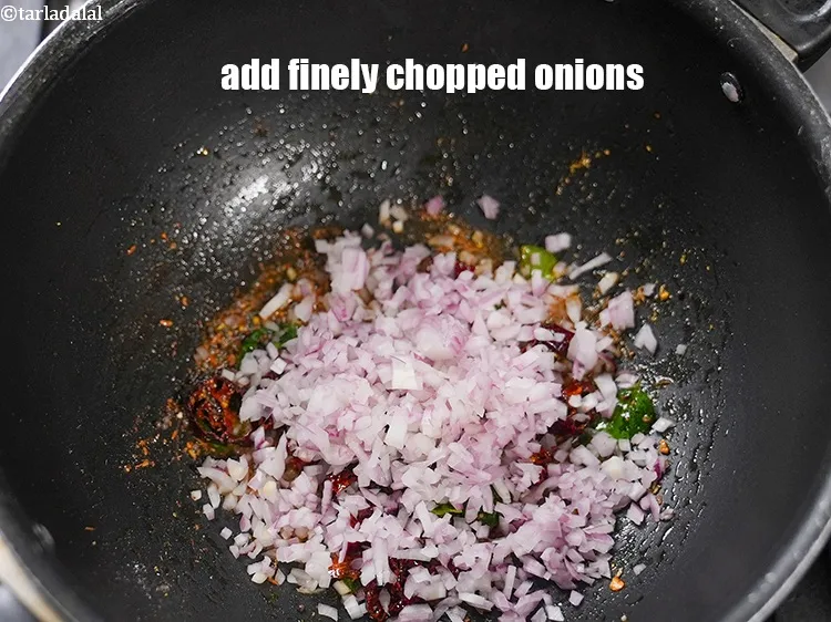 Step 18 – Add &frac12; cup finely <a href="https://www.tarladalal.com/glossary-chopped-onions-722i">chopped onions</a>.