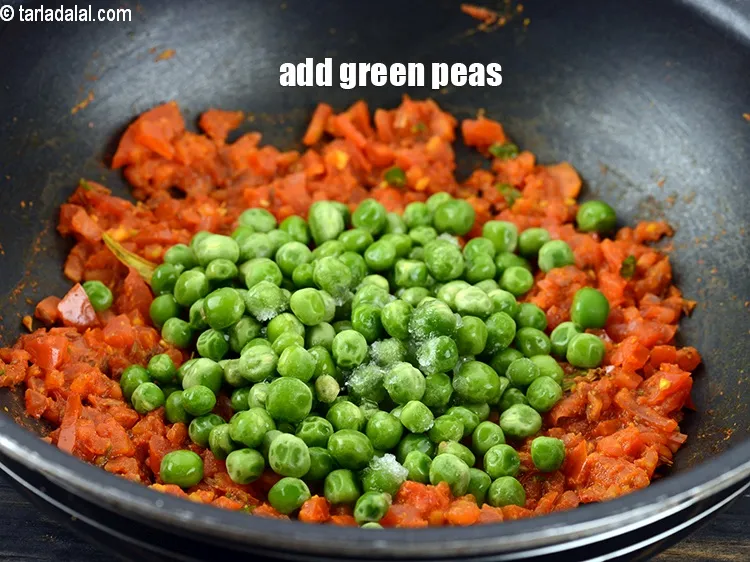 Step 18 – Add &frac12; cup <a href="https://www.tarladalal.com/glossary-green-peas-matar-hare-matar-vatana-180i">green peas</a>.