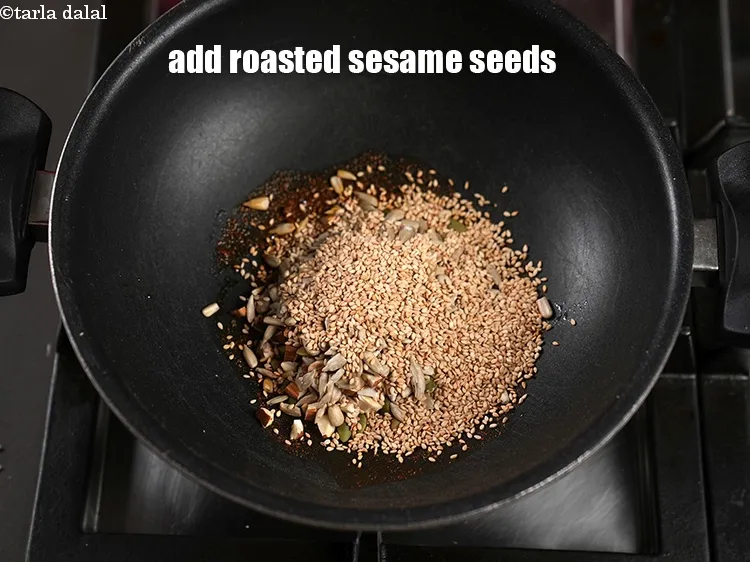 Step 18 – Add 2 tbsp <a href="https://www.tarladalal.com/glossary-roasted-sesame-seeds-2271i">roasted sesame seeds (til)</a>.