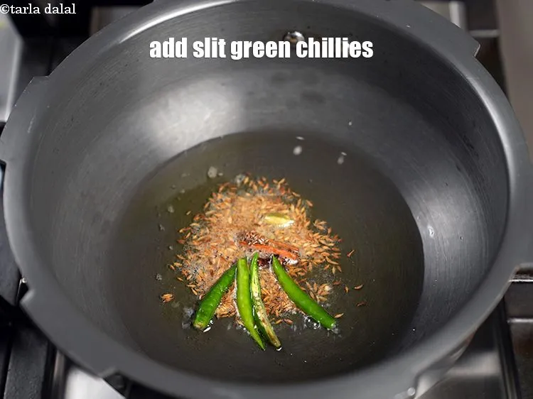 Step 18 – Add 2 slit green chillies.&nbsp;