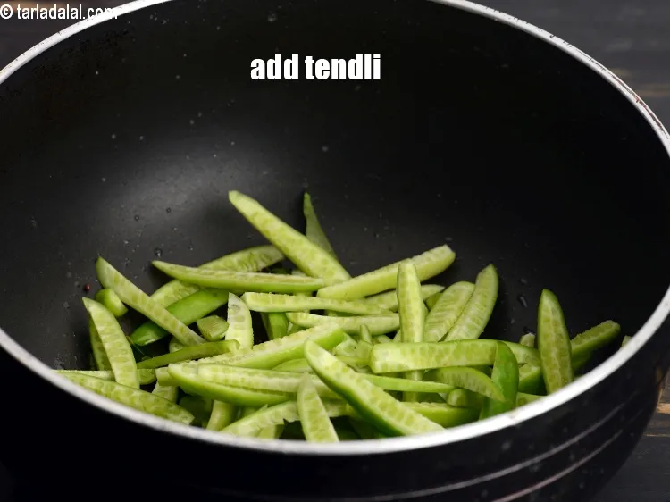Step 20 – Add 1 cup&nbsp;<a href="https://www.tarladalal.com/glossary-sliced-tendli-1161i">sliced tendli (ivy gourd)</a>.&nbsp;
