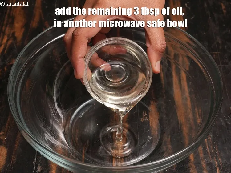 Step 18 – Add the remaining 3 tbsp of <a href="https://www.tarladalal.com/glossary-oil-671i">oil</a>, in another microwave safe bowl.