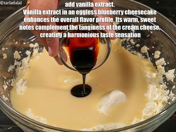 Step 18 – Add 1 tsp <a href="https://www.tarladalal.com/glossary-vanilla-extract-1248i">vanilla extract</a>. Vanilla extract in an eggless blueberry cheesecake enhances the …