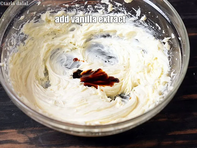 Step 19 – Add &frac12; tsp <a href="https://www.tarladalal.com/glossary-vanilla-extract-1248i">vanilla extract</a>.