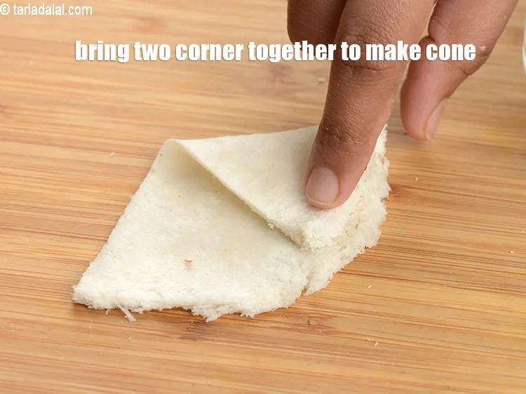 Step 18 – Bring two corner together to make a cone shape.