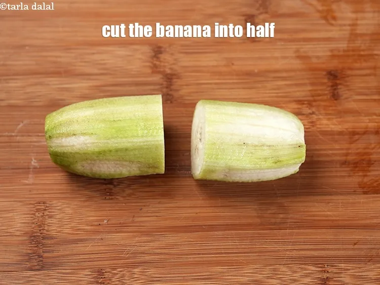 Step 18 – Cut the banana into half.