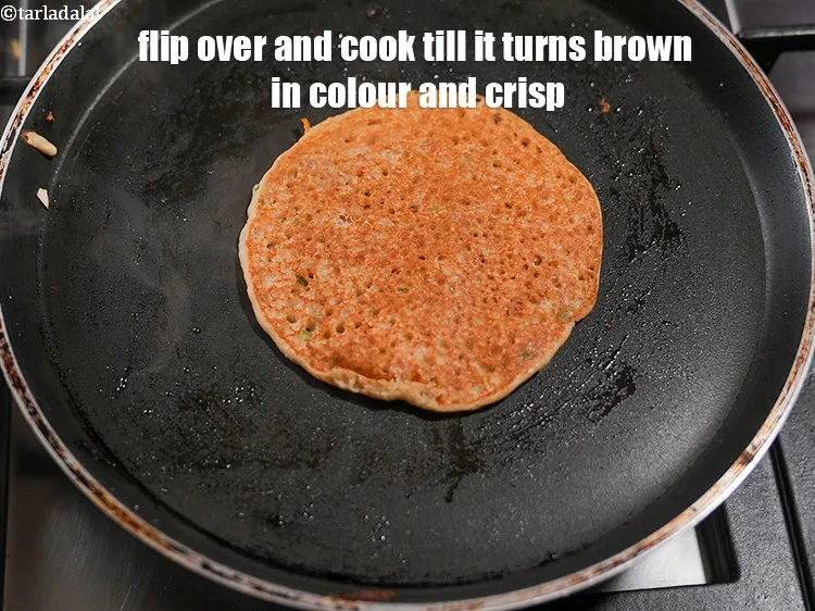 Step 25 – Flip over and cook on a medium flame till the uttapam turns brown in colour …