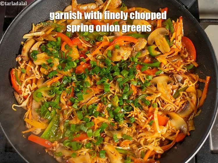 Step 18 – Garnish with &frac14; cup finely&nbsp;<a href="https://www.tarladalal.com/glossary-chopped-spring-onion-greens-1030i">chopped spring onion greens</a>.