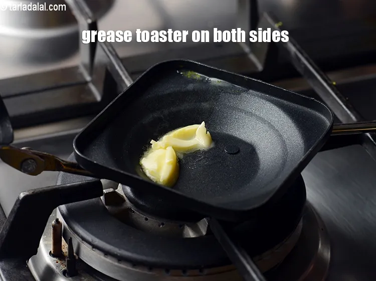 Step 19 – Grease a sandwich toaster on both the sides using 1 tsp of butter.