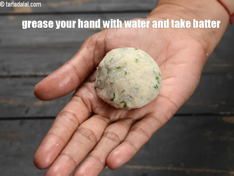 Step 18 – Grease your hand with water and take some batter.