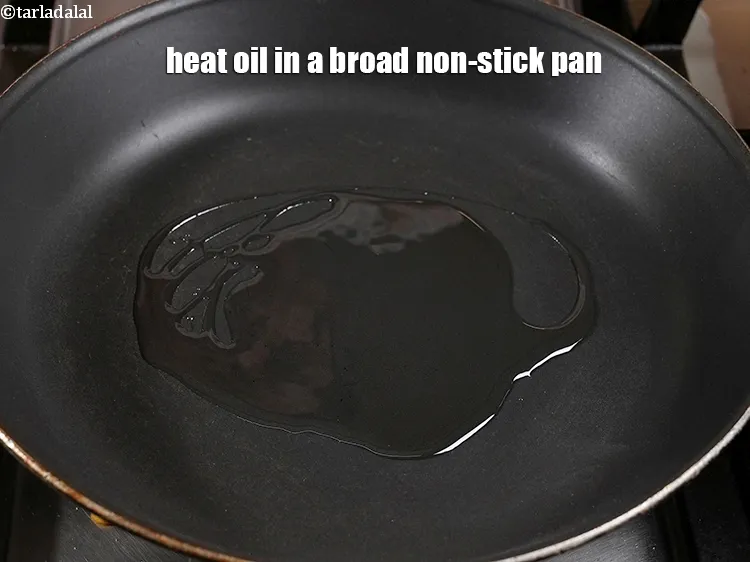 Step 18 – Heat 2 tbsp oil in a broad non-stick pan.
