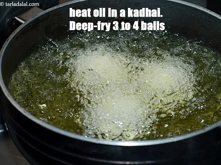 Step 18 – Heat the oil in a kadhai. Deep-fry 3 to 4 balls at a time.