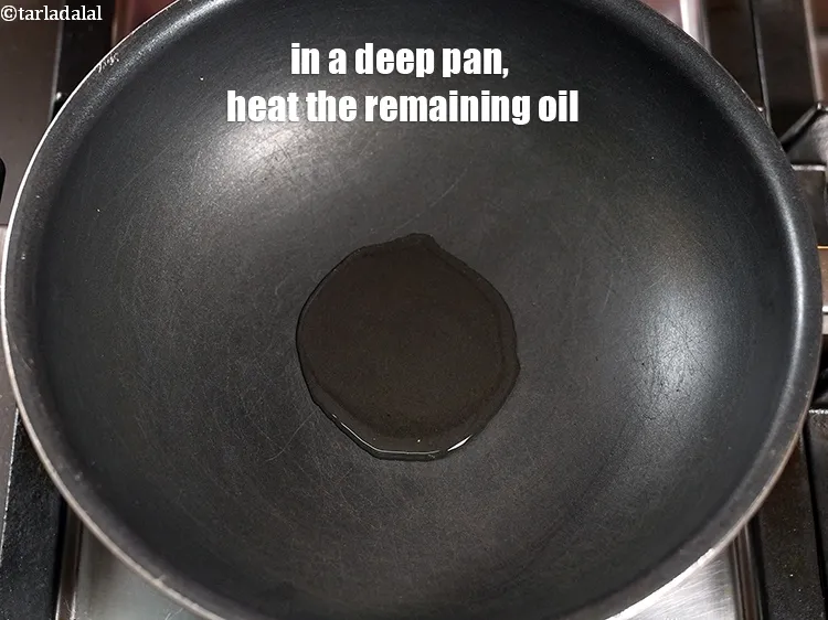 Step 18 – In a deep pan, heat the remaining 1 tbsp <a href="https://www.tarladalal.com/glossary-oil-671i">oil</a>.