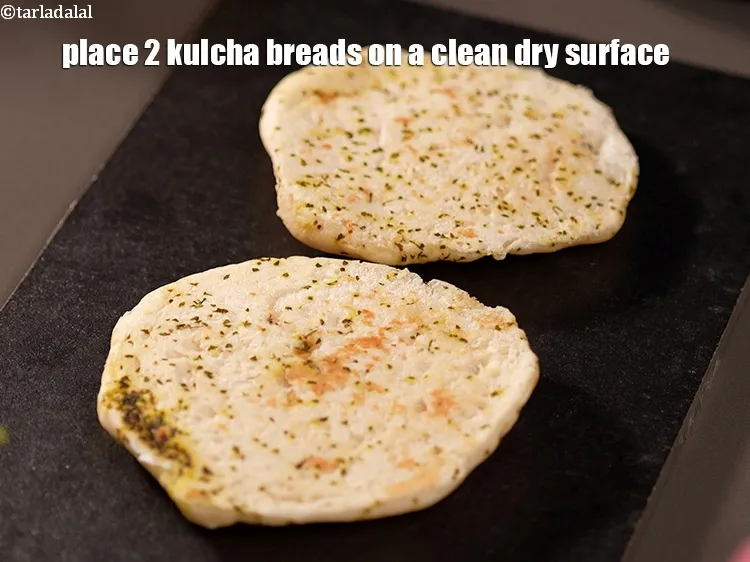 Step 18 – Place 2 kulcha breads on a clean dry surface.