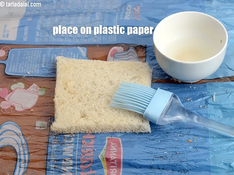 Step 18 – Place a slice of the bread on the bread plastic paper.