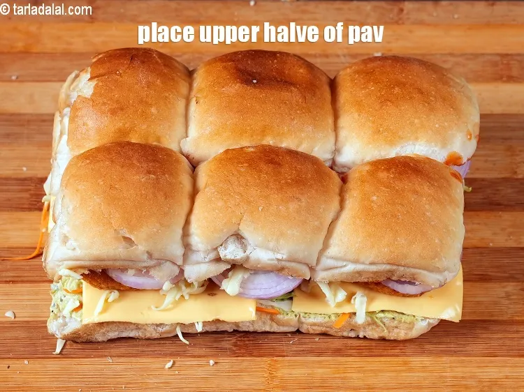 Step 21 – Place the upper halve of the pav sauce side facing downwards.