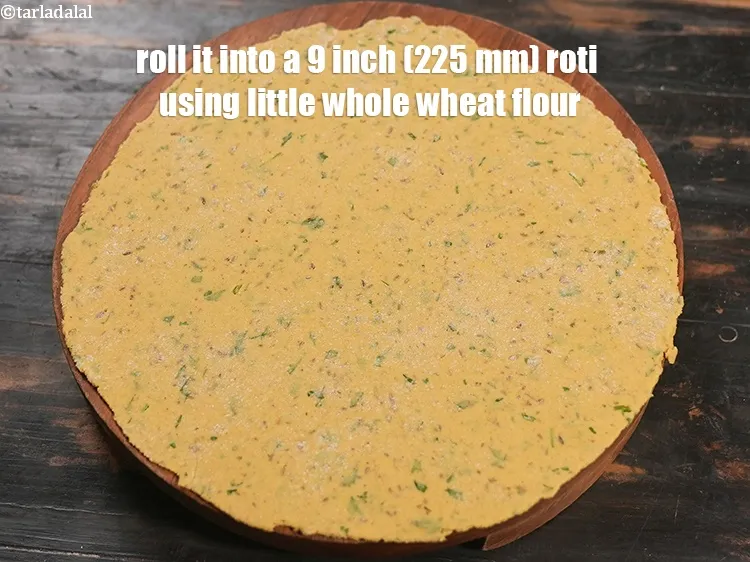 Step 18 – Roll it into a 9 inch (225 mm) roti using little whole wheat flour.