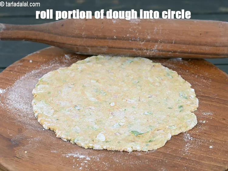 Step 18 – Roll a portion of the dough into a 150 mm. (6&rdquo;) diameter circle using a …