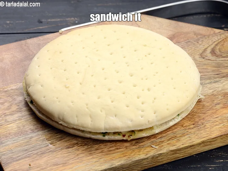 Step 18 – Sandwich it with using the buttered-garlic mixture facing downwards.&nbsp;
