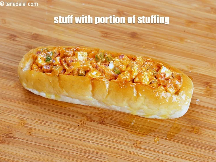 Step 19 – Stuff with a portion of the stuffing.&nbsp;