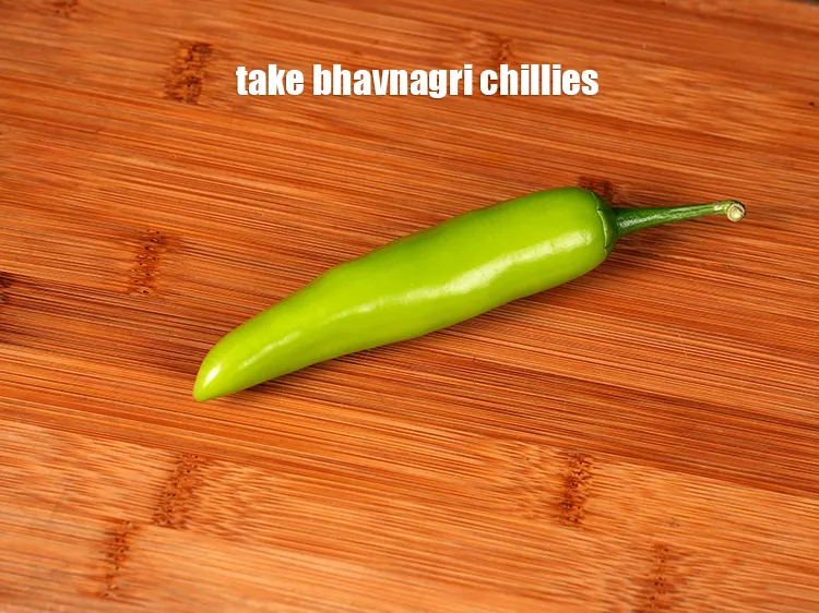 Step 17 – Take a <a href="https://www.tarladalal.com/glossary-bhavnagri-chillies-bhavnagri-mirchi-337i">bhavnagri chillies</a>.