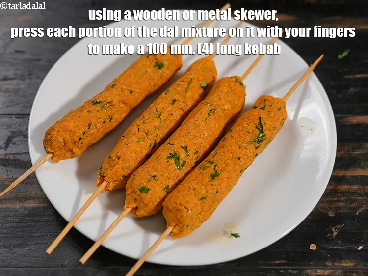 Step 21 – Using a wooden or metal skewer, press each portion of the dal mixture on it …