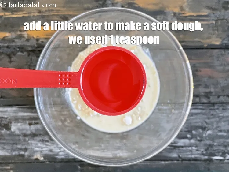 Step 18 – Add a little water to make a soft dough. We added 1 tsp water.