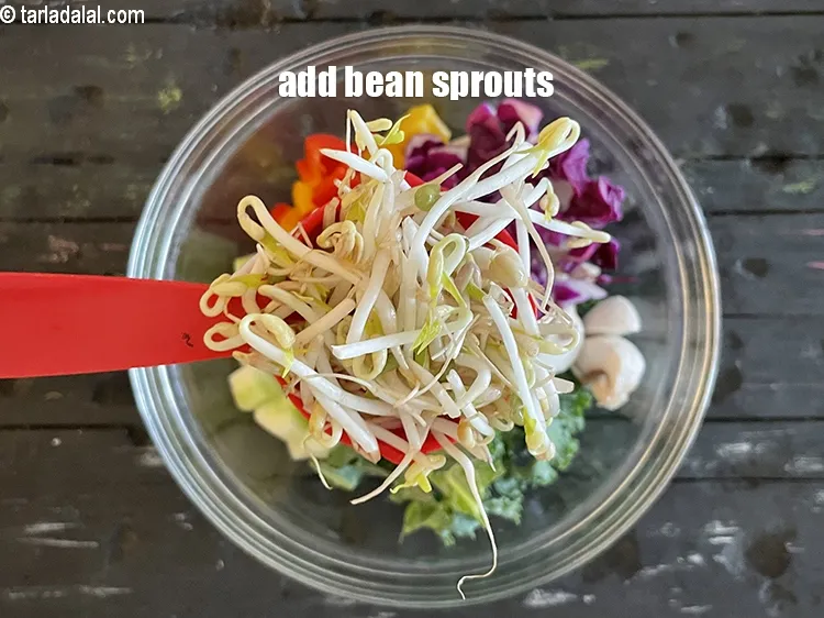 Step 31 – Add&nbsp;<meta charset="UTF-8" />1/4 cup&nbsp;<a href="glossary-bean-sprouts-193i">bean sprouts</a>.