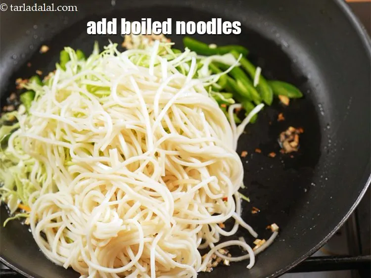 Step 19 – Add 1 cup <a href="https://www.tarladalal.com/glossary-boiled-noodles-2010i">boiled noodles</a>.