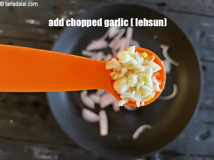 Step 19 – Add&nbsp;<meta charset="UTF-8" />2 tsp&nbsp;<a href="glossary-chopped-garlic-790i">chopped garlic (lehsun)</a>.
