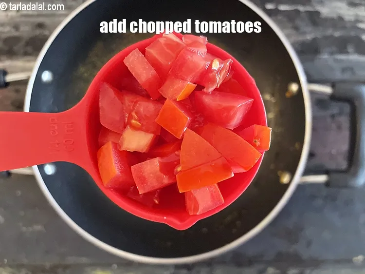 Step 18 – Add&nbsp;<meta charset="UTF-8" />1/4 cup&nbsp;<a href="glossary-chopped-tomatoes-779i">chopped tomatoes</a>.