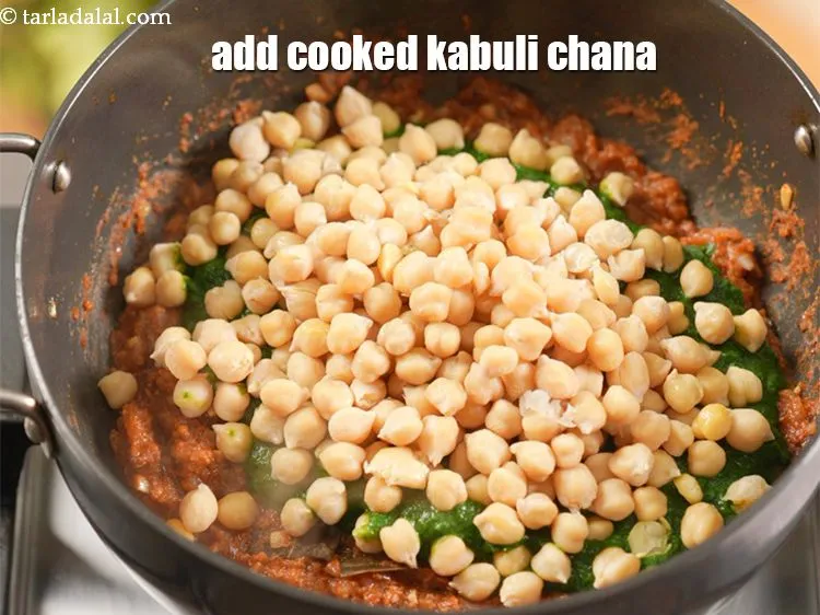 Step 18 – Add 2 cups <a href="https://www.tarladalal.com/glossary-boiled-kabuli-chana-1354i">cooked kabuli chana (chick peas)</a>.