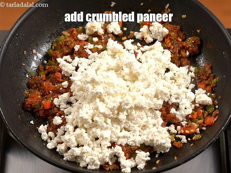 Step 20 – Switch off the flame, add 1 &frac14; cup <a href="https://www.tarladalal.com/glossary-crumbled-paneer-997i">crumbled paneer (cottage cheese)</a>.