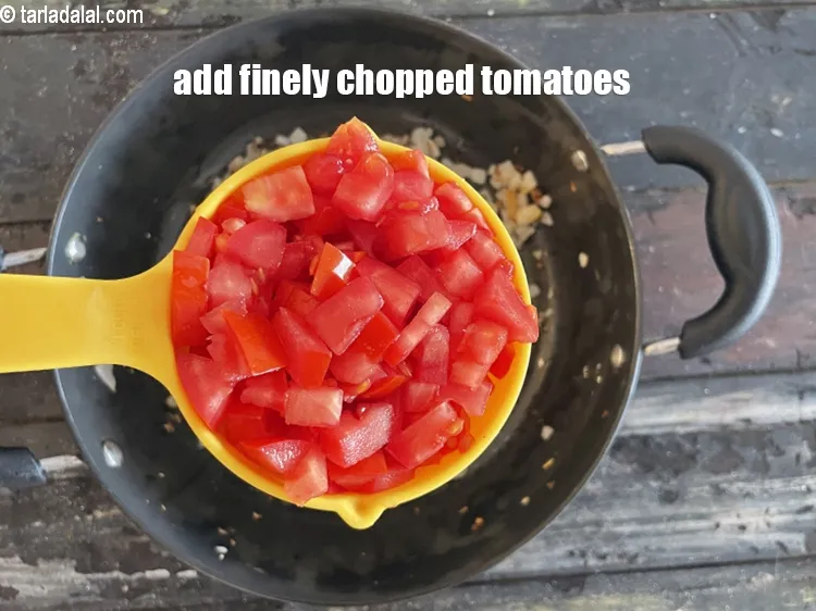 Step 28 – Add&nbsp;<meta charset="UTF-8" />1 cup&nbsp;finely&nbsp;<a href="glossary-chopped-tomatoes-779i">chopped tomatoes</a>.