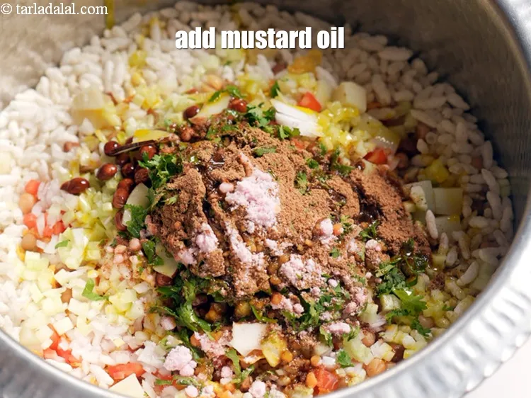 Step 19 – Add 2 tbsp <a href="https://www.tarladalal.com/glossary-mustard-oil-rai-ka-tel-sarson-ka-tel-942i">mustard (rai / sarson) oil</a>.