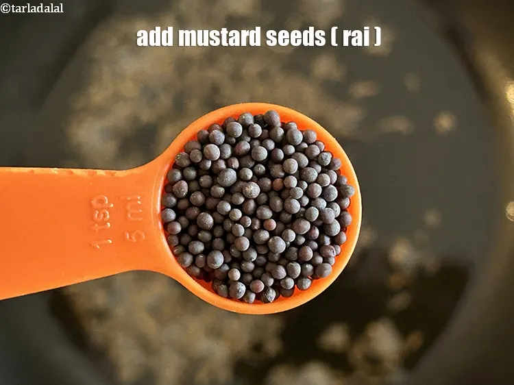 Step 18 – <html><head></head><body><p>Add&nbsp;1 tsp&nbsp;<a href="glossary-mustard-seeds-sarson-rai-sarson-ke-beej-525i">mustard seeds ( rai / sarson)</a>.</p></body></html>