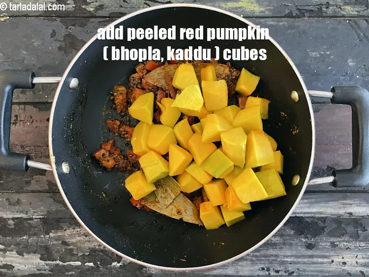 Step 23 – Add&nbsp;<meta charset="UTF-8" />2 cups&nbsp;peeled&nbsp;<a href="glossary-red-pumpkin-cubes-1530i">red pumpkin (bhopla / kaddu) cubes</a>.