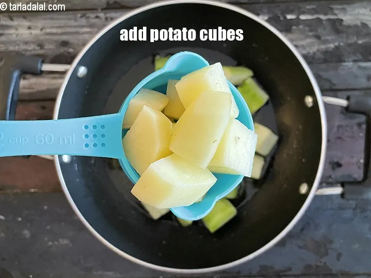 Step 19 – Add&nbsp;<meta charset="UTF-8" />1/2 cup&nbsp;peeled&nbsp;<a href="glossary-potato-cubes-725i">potato cubes</a>.